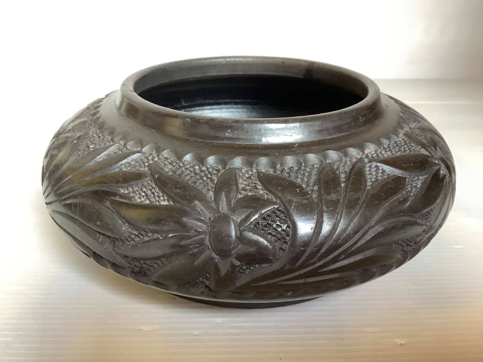 Black pottery catchall worked from Marginea, Romania.