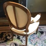 Louis XVI period cabriolet armchair with medallion back