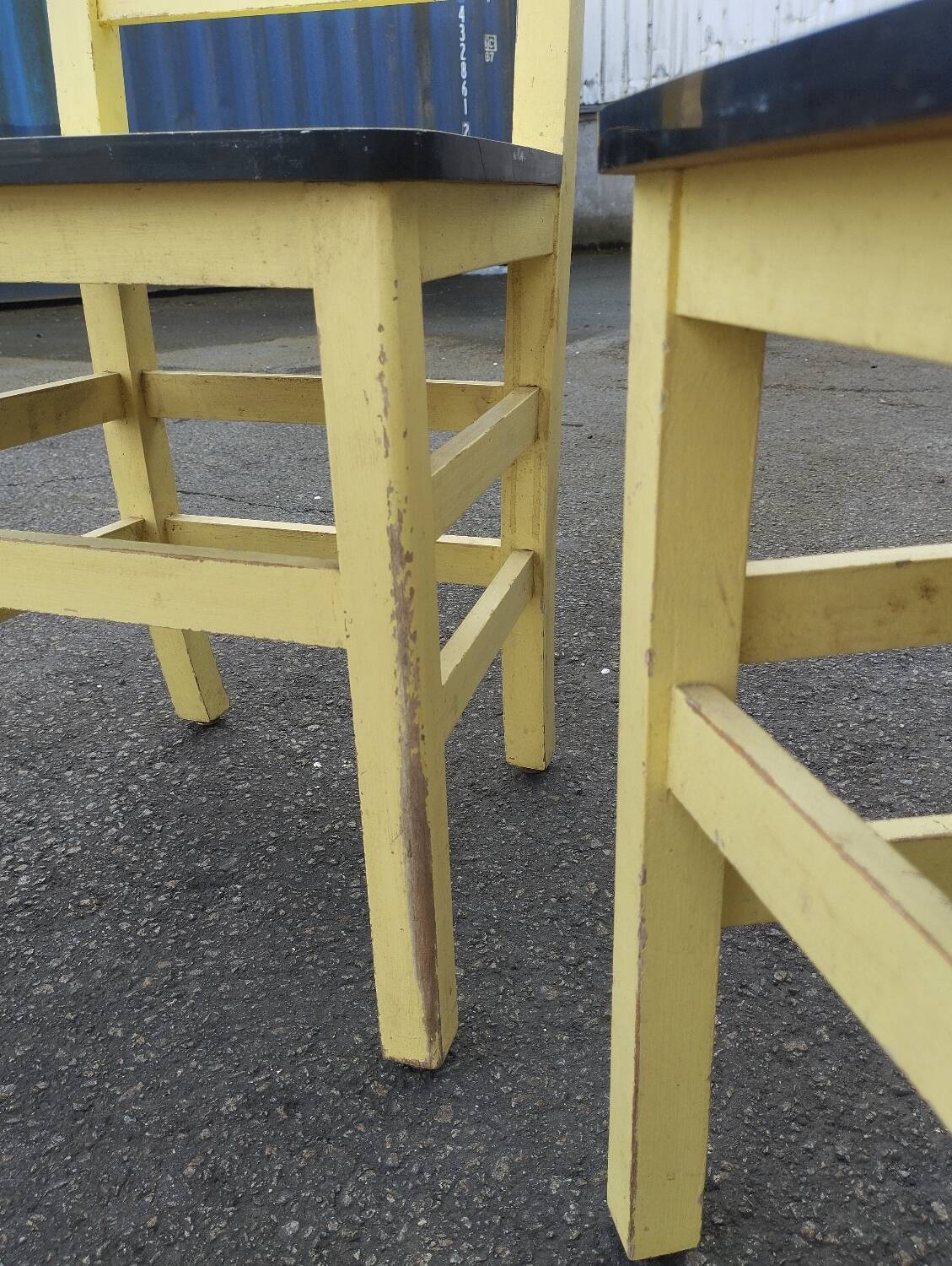 Pair of wooden and yellow formica chairs