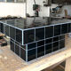 Black tiled coffee table and midnight blue grout
