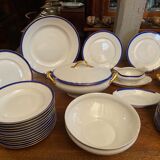 Limoges porcelain table service with blue band on white and gold background