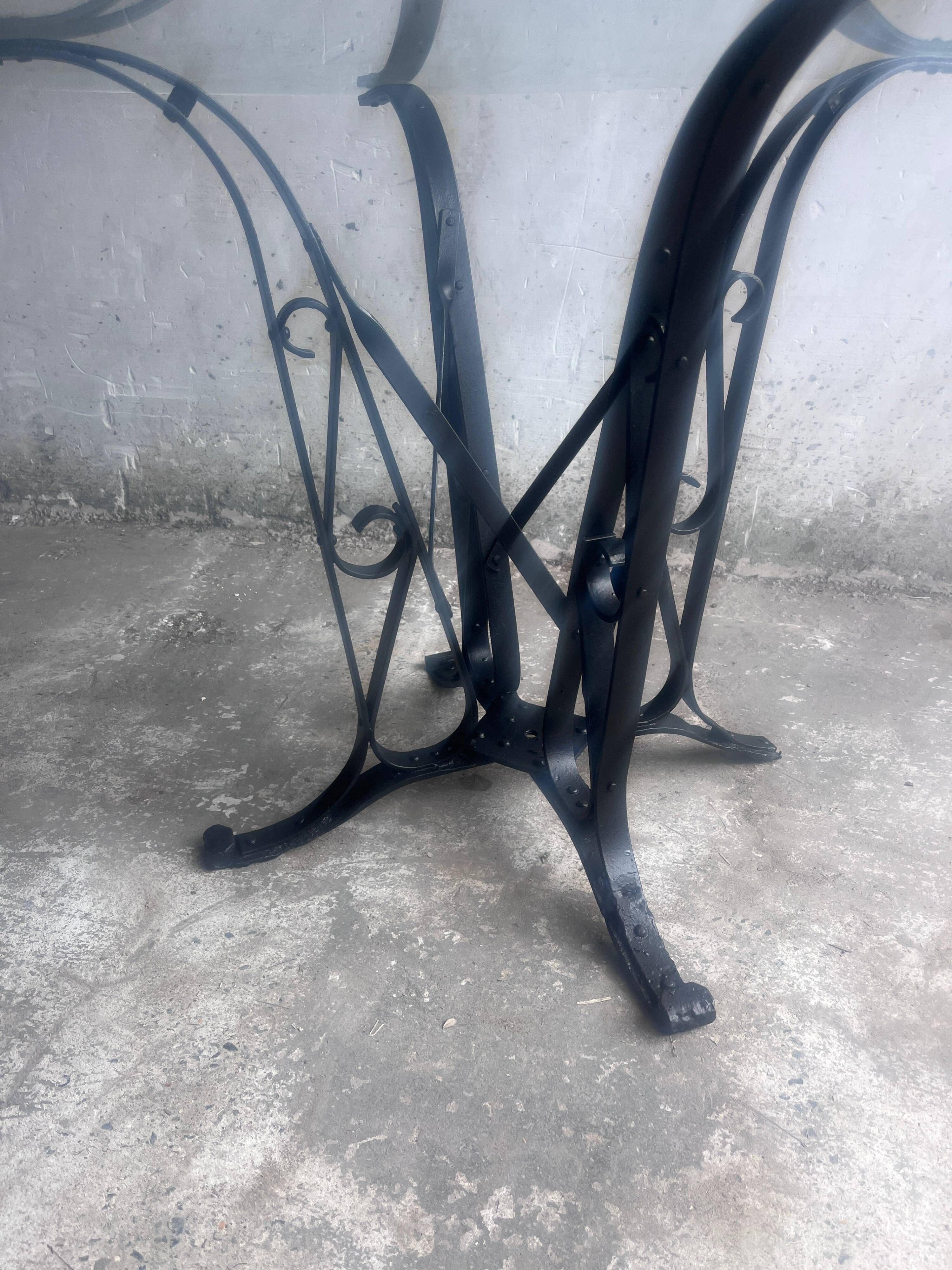 French Art Deco dining table in wrought iron and glass, circa 1930.