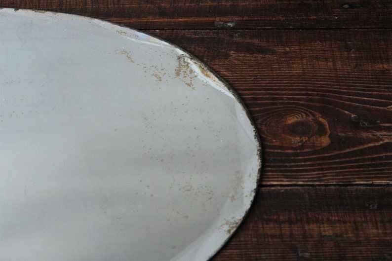 Old oval beveled art deco mirror