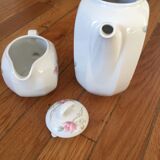 Vintage porcelain coffee or teapot with milk jug