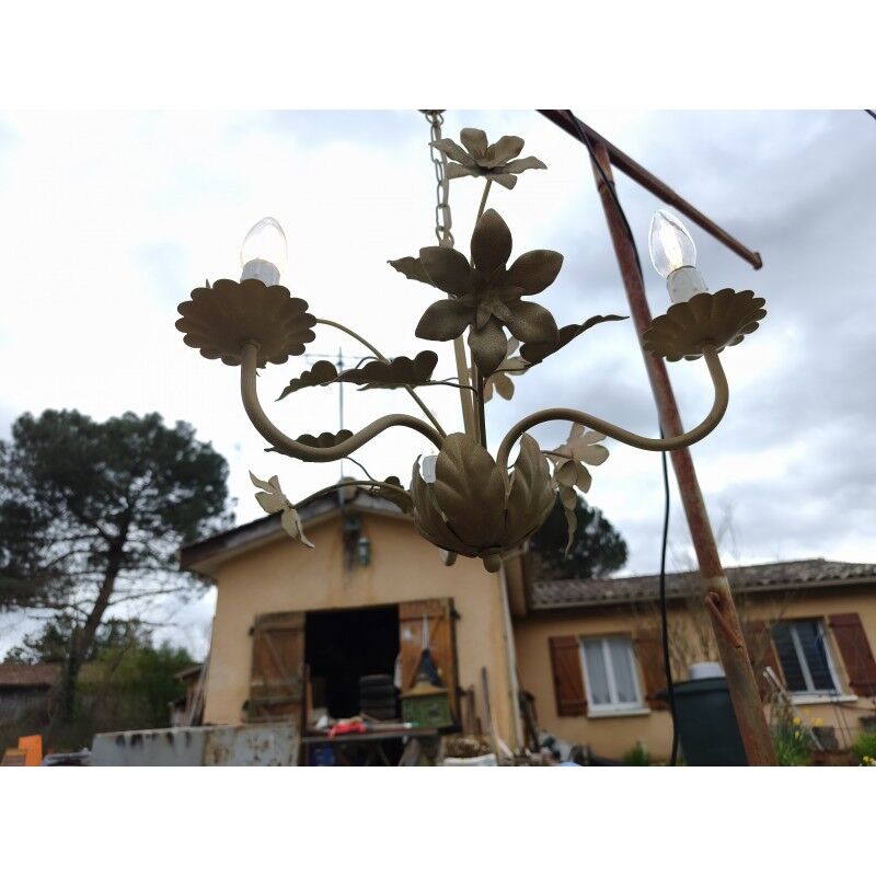 Vintage gold metal chandelier with floral decoration.