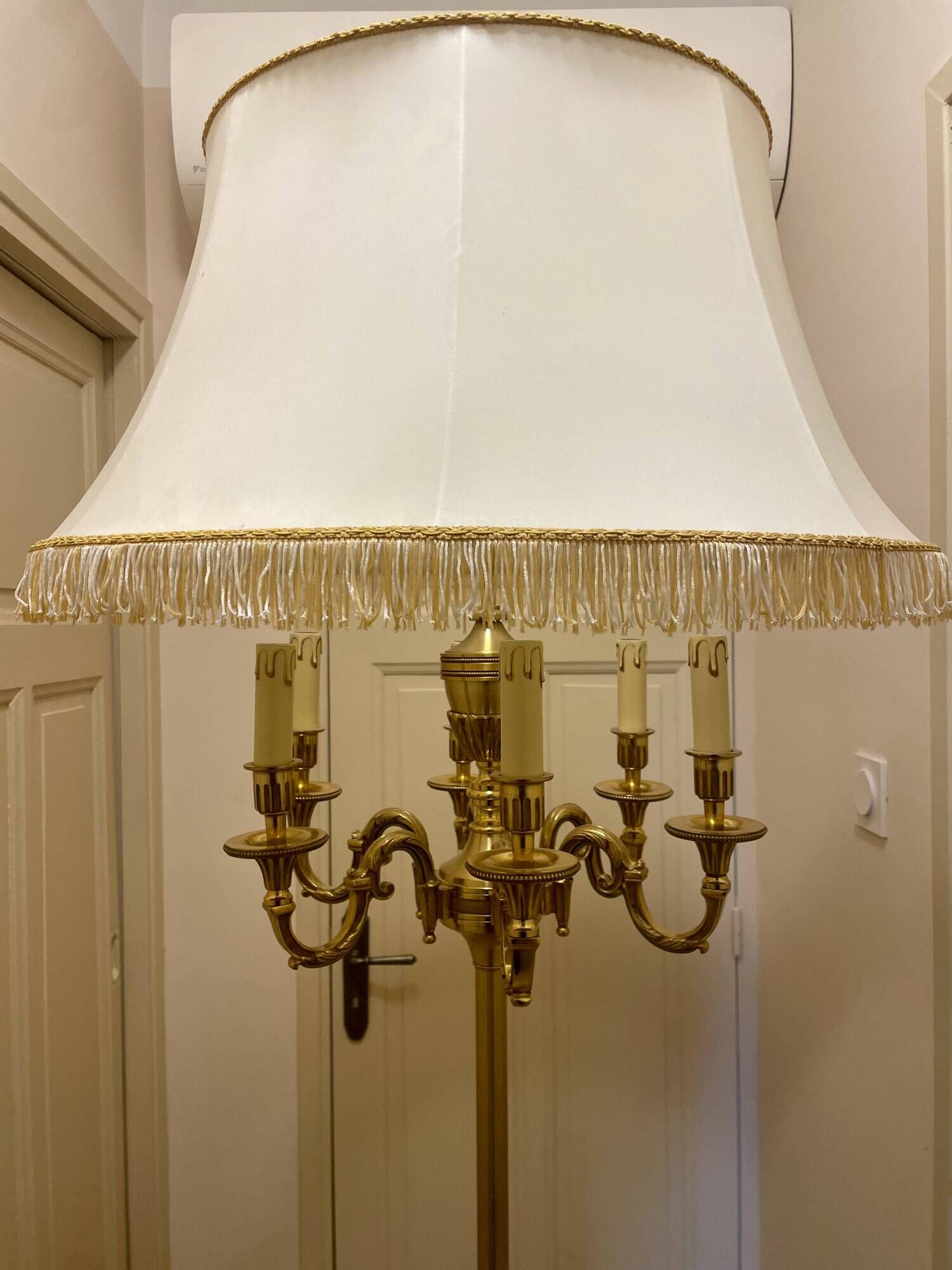 Bronze floor lamp by Lucien Gau, with a six-light shade model 16136.