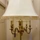 Bronze floor lamp by Lucien Gau, with a six-light shade model 16136.