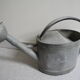 old zinc deco watering can