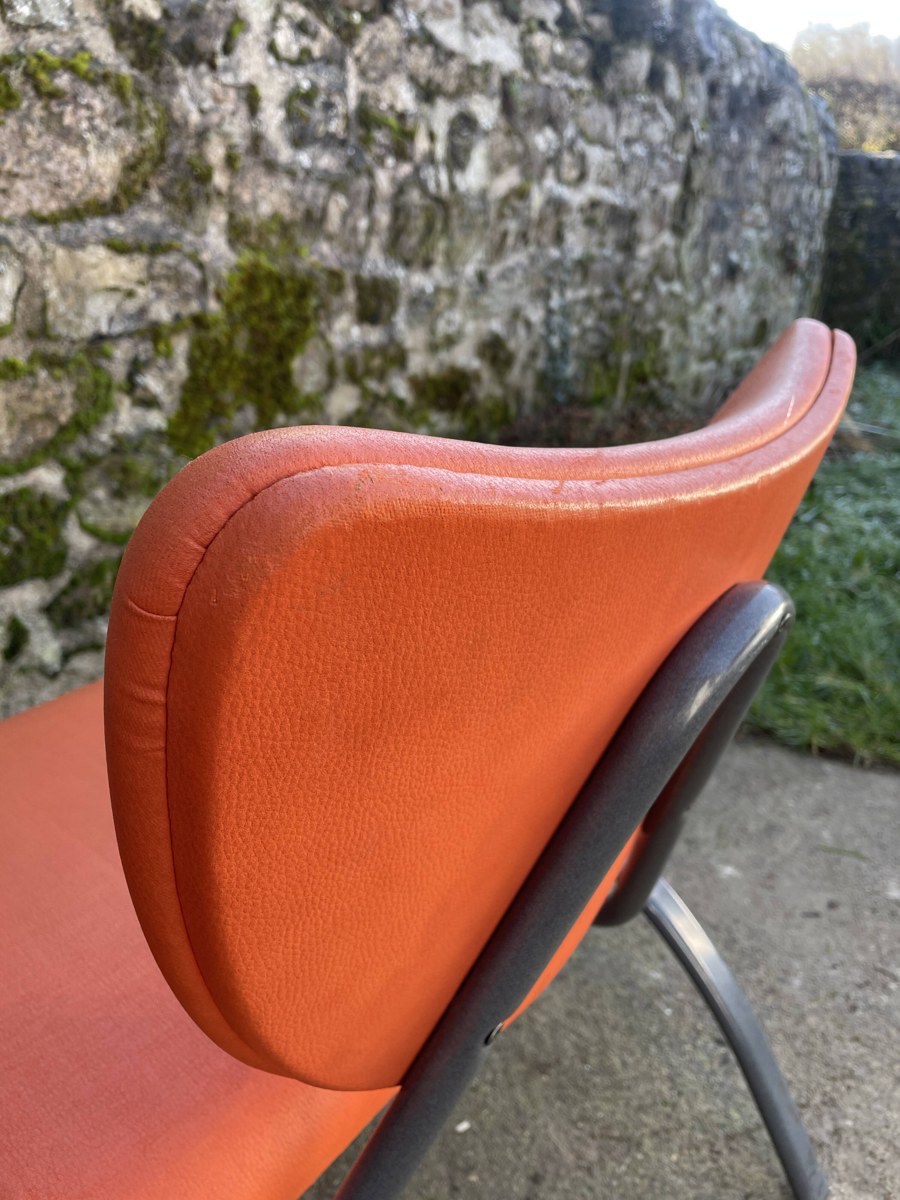 Pair of faux leather armchairs