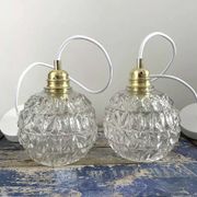 Set of two chiseled glass pendant lights