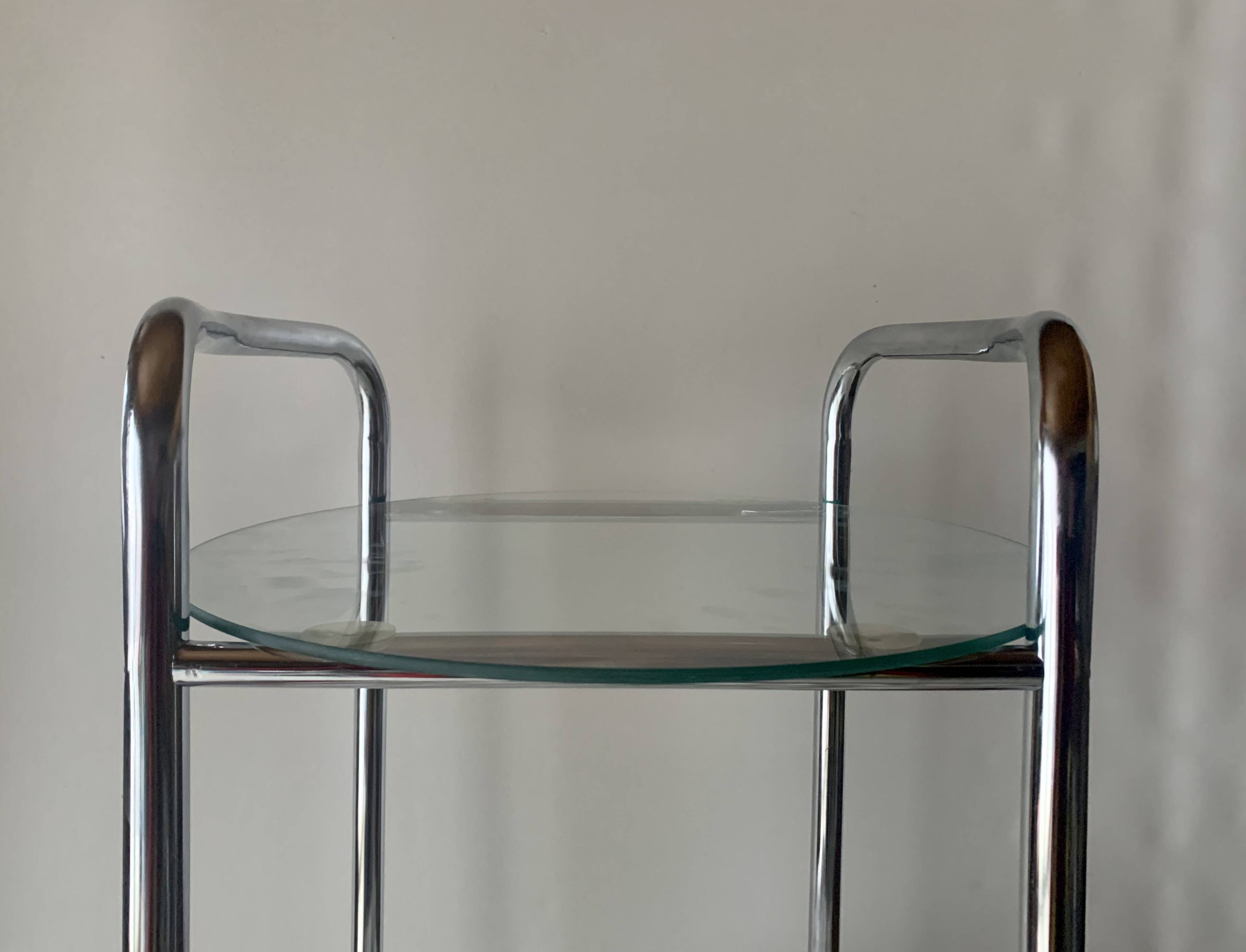 Pedestal table, vintage chrome steel saddle with 2 round windows