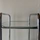 Pedestal table, vintage chrome steel saddle with 2 round windows
