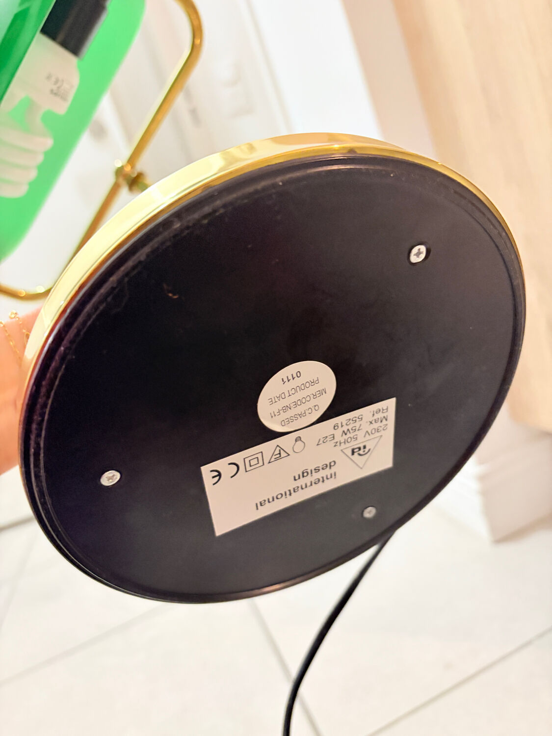 Gold and green banker’s desk lamp.