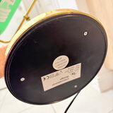 Gold and green banker’s desk lamp.