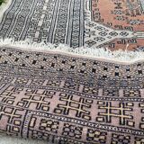 Vintage hand knotted rug with geometric patterns on a grey/beige/terracotta background 170 x 96 cm