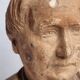 Bust of a notable in terracotta, 29 cm, signed Pasquet, 1870, on a base.