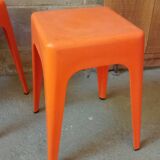 Pair of AMI stools in orange plastic