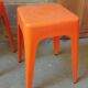 Pair of AMI stools in orange plastic