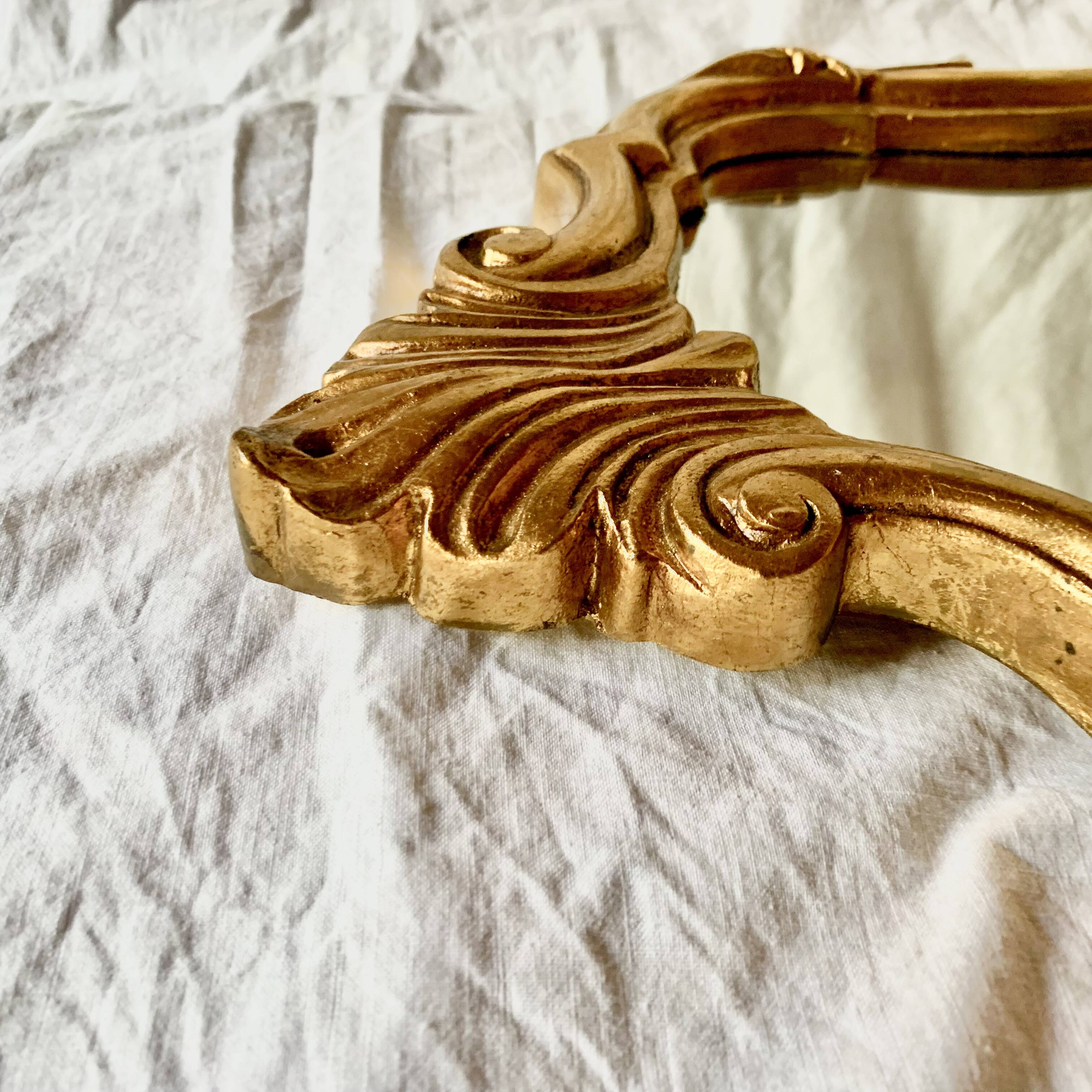 Antique wall mirror in gold leaf resin