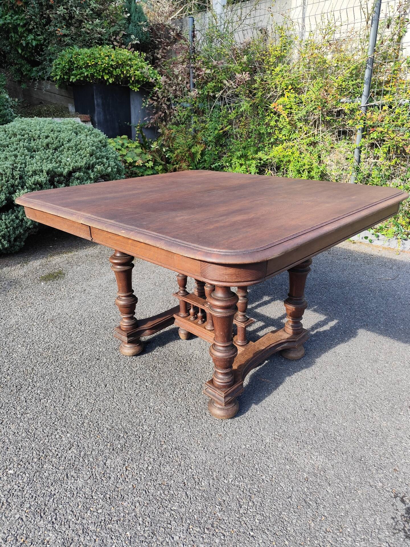Square wooden table in Henri II style.