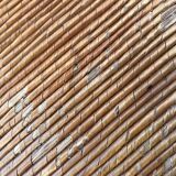 Vintage armchair in straw and brutalist wood