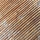 Vintage armchair in straw and brutalist wood