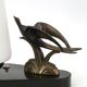 Art Deco lamp with swallow sculpture, marble base, opaque white globe.