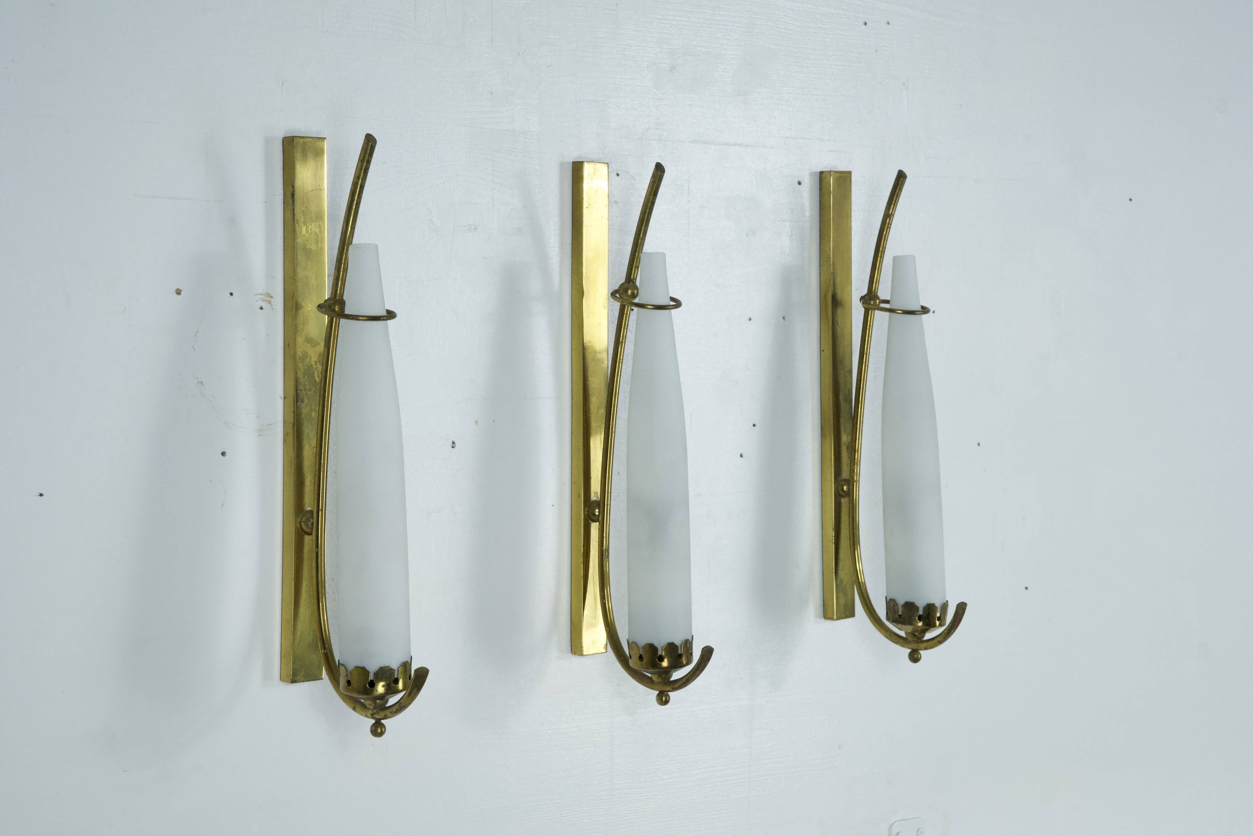 Set of three sconces in brass and triplex opaline glass. Italy 1950s