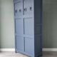 Vintage grey wooden wardrobe from 1914.