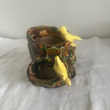 Old slipware birds on a tree trunk