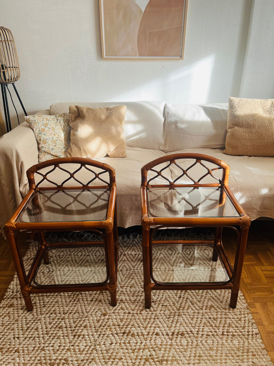 Two rattan and glass bedside tables