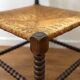 Turned wood corner chair with straw seat