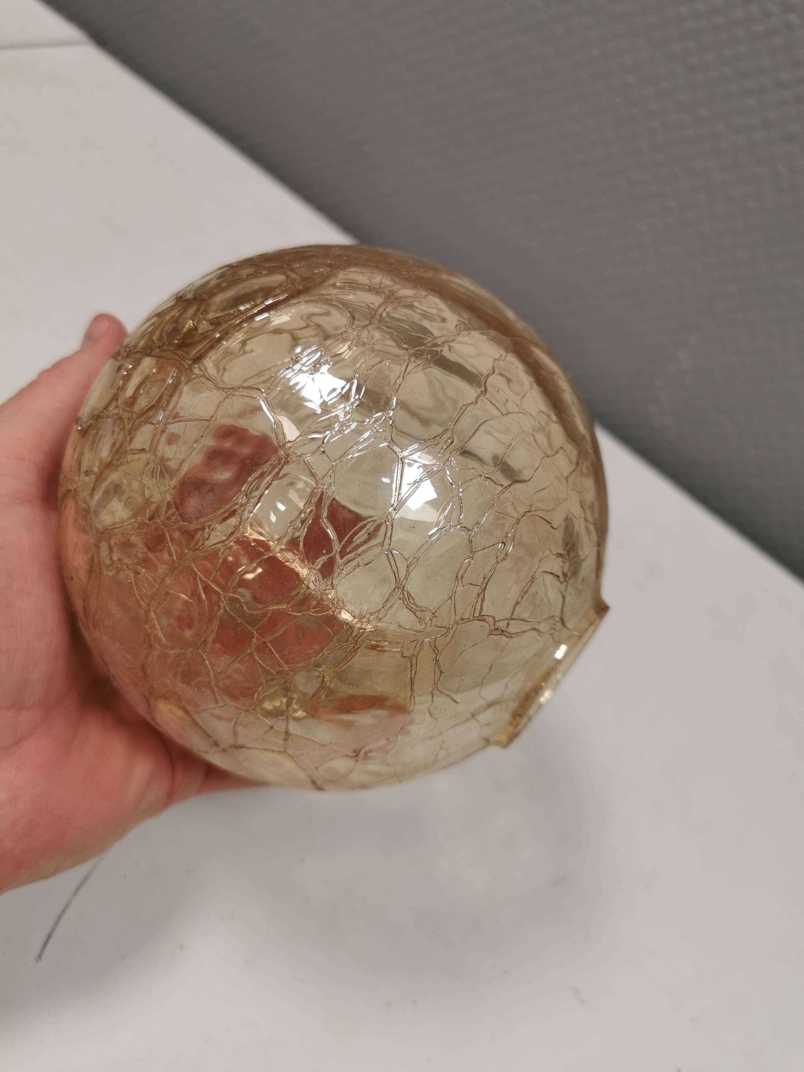 Older wall lamp in metal, brass and “cracked” glass.