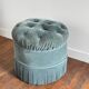 Velvet upholstered pouf