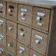 Antique German Pine Apothecary Cabinet with Enamel Shields, 1900s