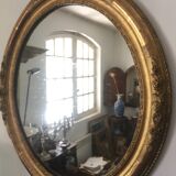 Miroir ovoïde dorure a la feuille d'or, debut xxème