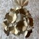 Ecru metal flower wall sconce