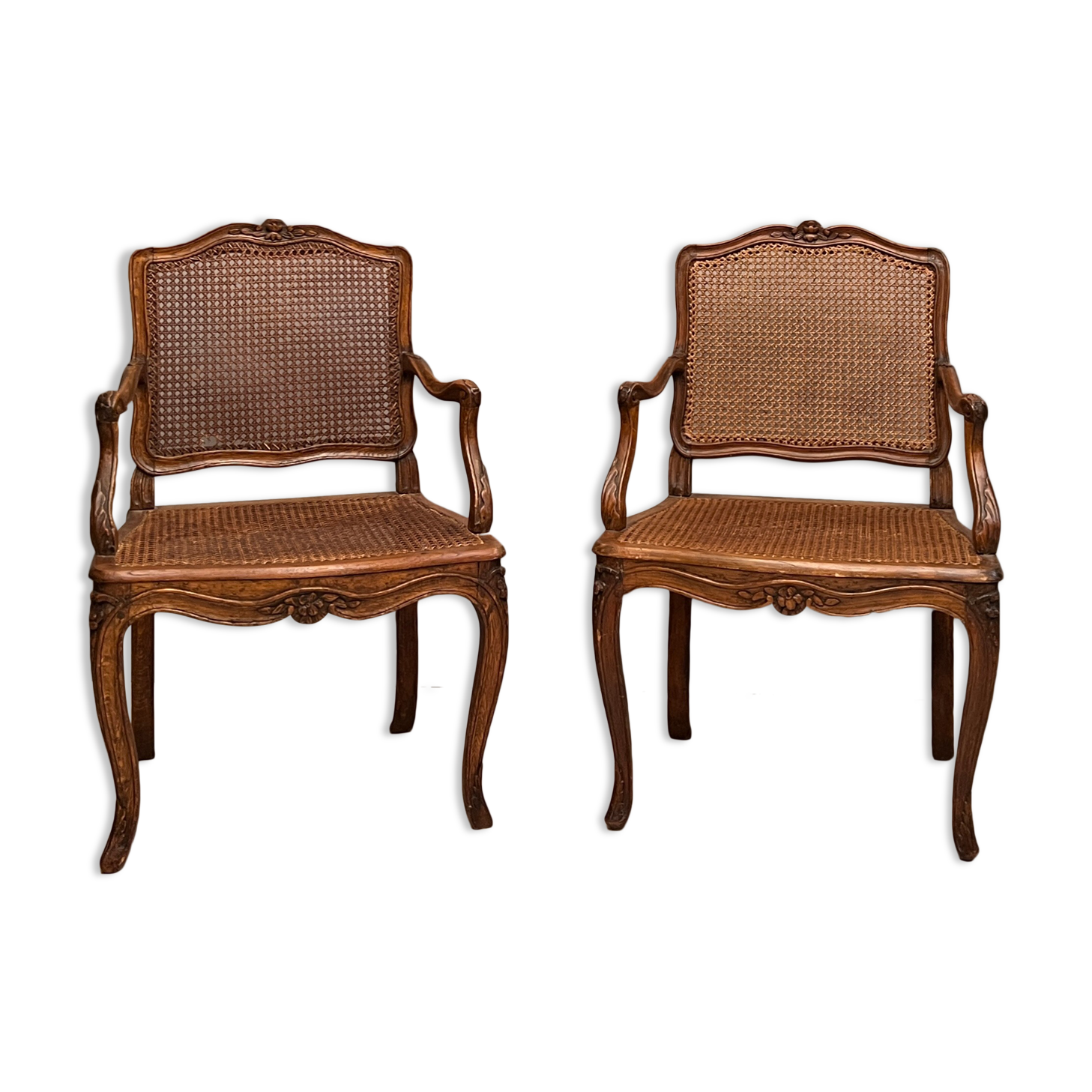 Paire de fauteuils cannés moulures et sculptes d'epoque régence