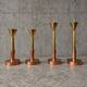 4 x Large / weighty postmodern candles / 1970s / two heights 60 - 70 cm / copper - brass