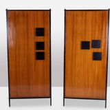 Pair of mahogany veneer and black lacquered iron cabinets. 1950s.
