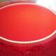 Pot-bellied, art deco vase in speckled ruby red multi-layered glass, white interior