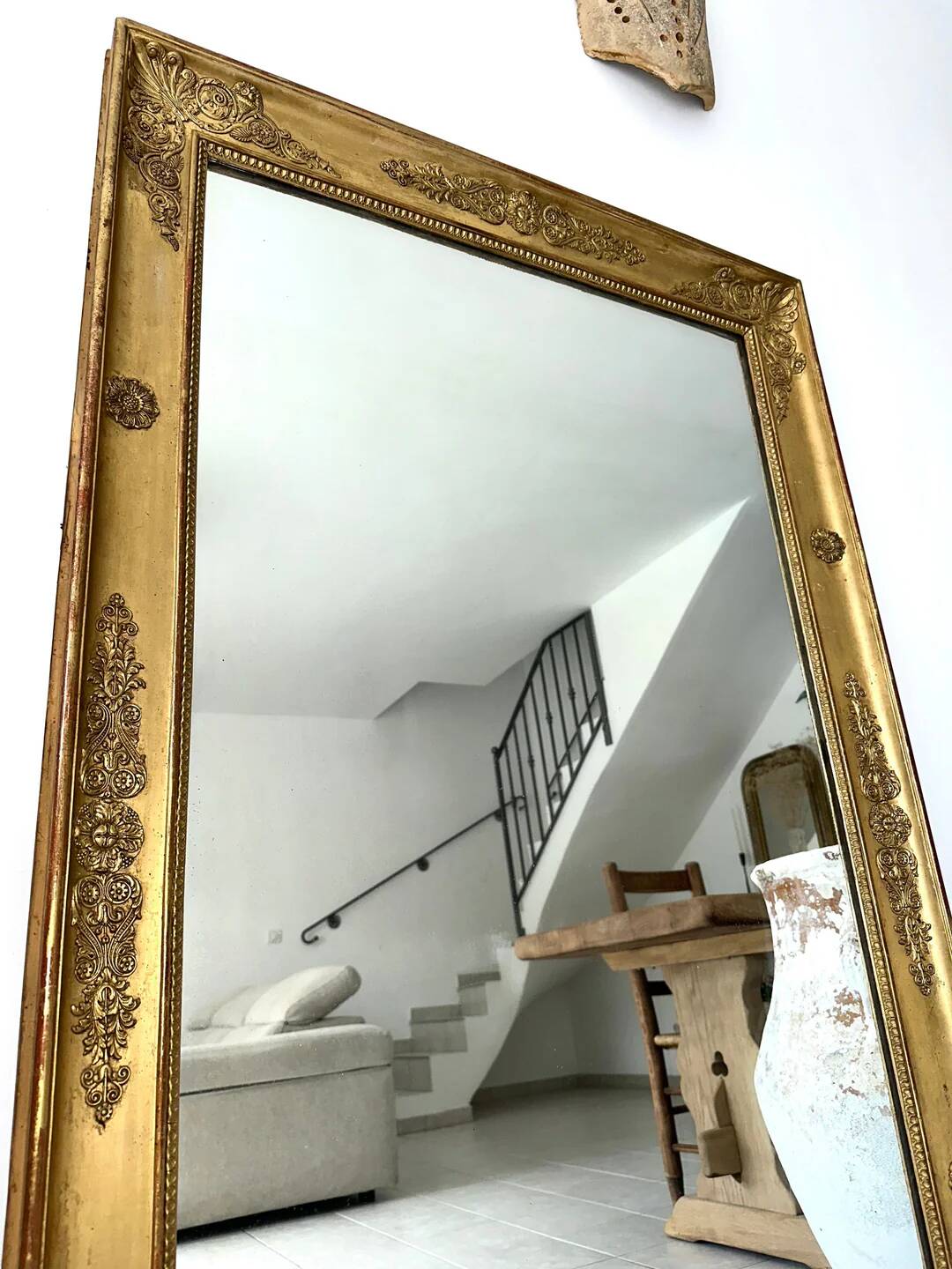 Antique gilded mirror from the Restoration period, 19th century.