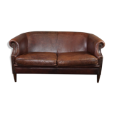 2-seater sofa in sheepskin decorative nails