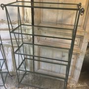 Pair of wrought iron and glass bookshelf shelves.