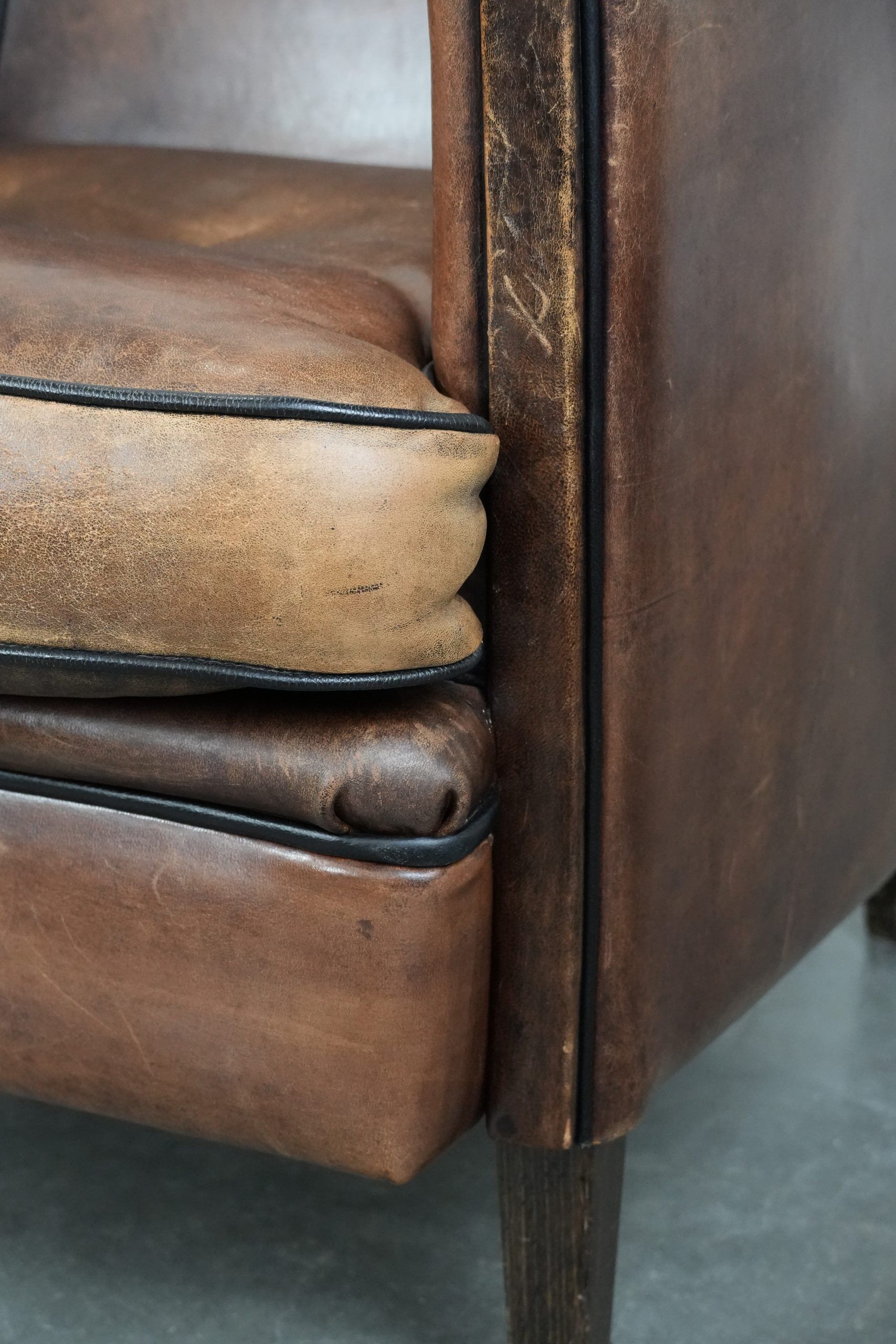 Sturdy vintage sheepskin club armchair with a beautiful patina