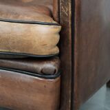 Sturdy vintage sheepskin club armchair with a beautiful patina