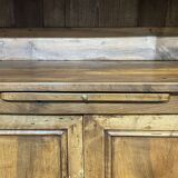 Library in walnut and oak from the early 20th century with its central clock.