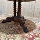 Round tripod gueridon from the Empire period with claw feet in mahogany and marble.