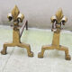 Old brass chenets & fleur de lys cast iron