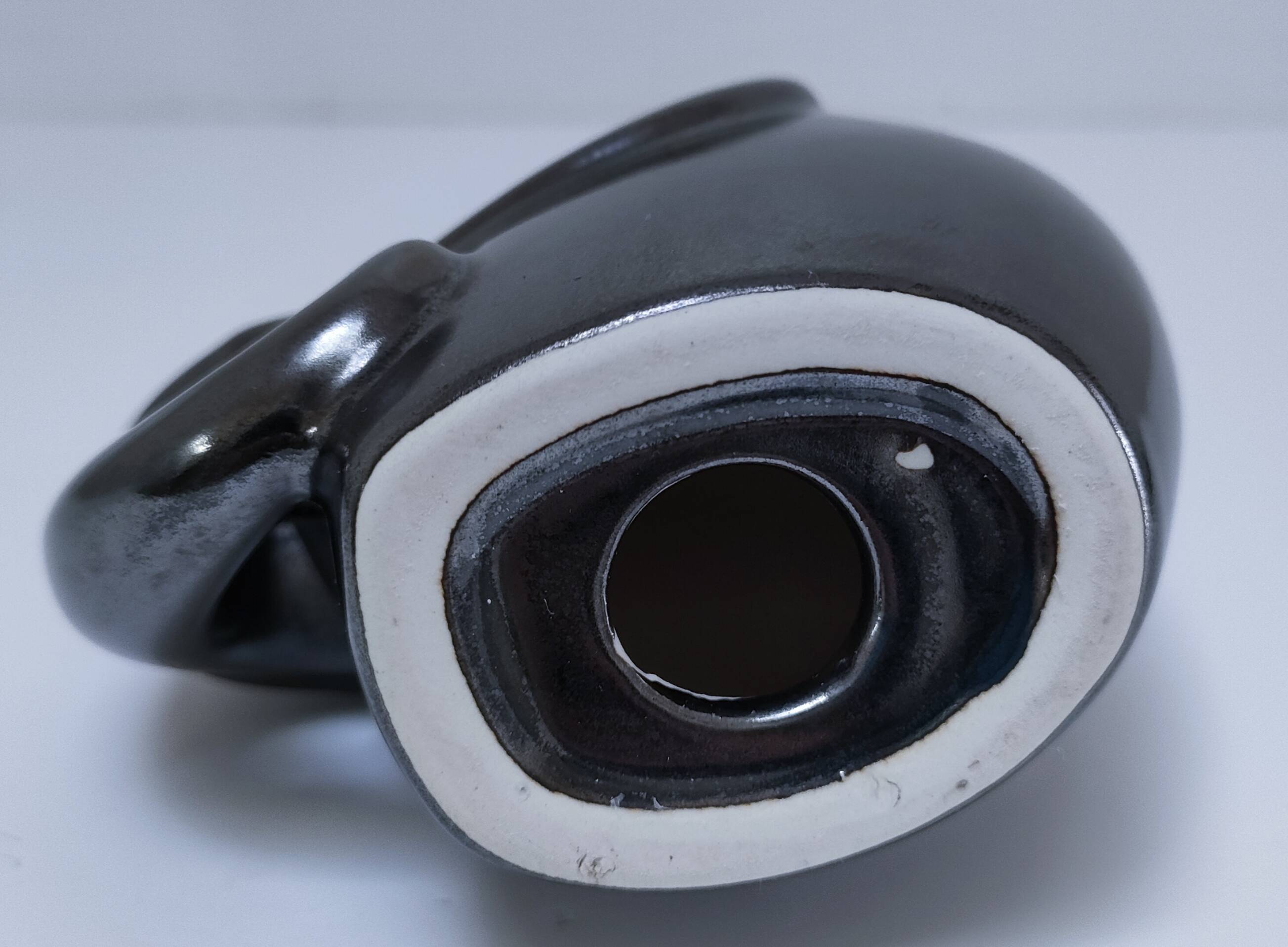 Two iridescent black and white ceramic elephants design